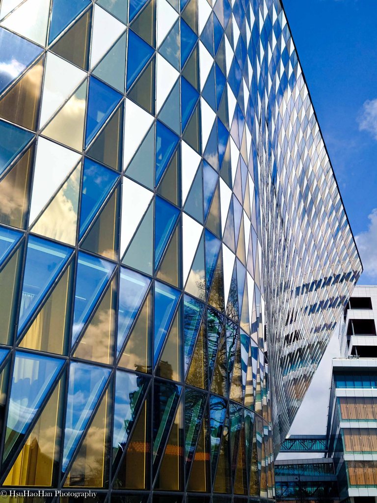 Abstract reflection on the colorful glass facade of Aula Medica - Aula Medica 建築立面光影反射與色彩細節 - Photo by Hsu Hao Han
