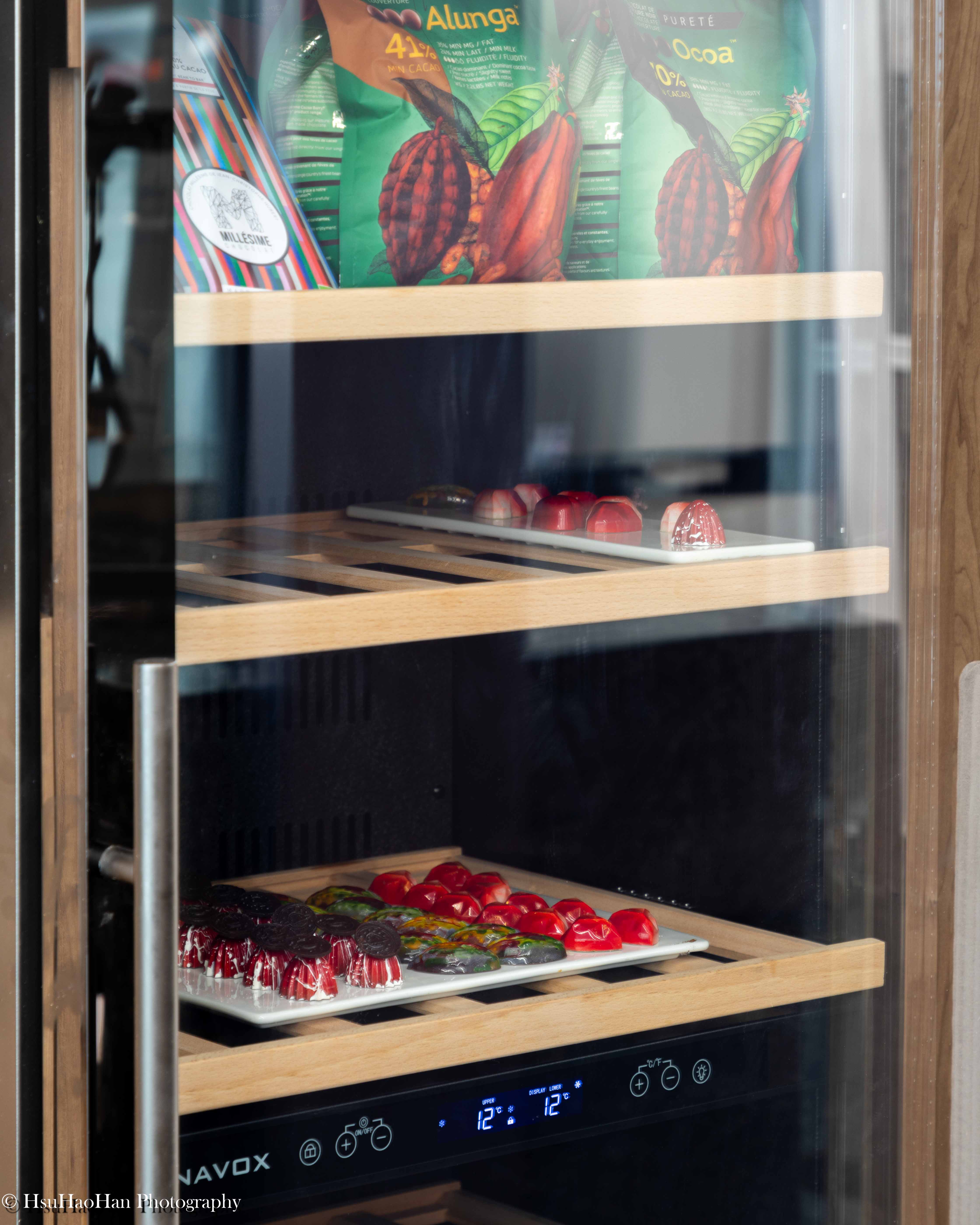 Temperature-controlled cabinet storing Cacao Barry ingredients and finished chocolate bonbons at Cocoa Heaven - 明道中學巧心坊專業溫控櫃內的巧克力原料與精緻手工巧克力成品 - Photography by Hsu Hao Han