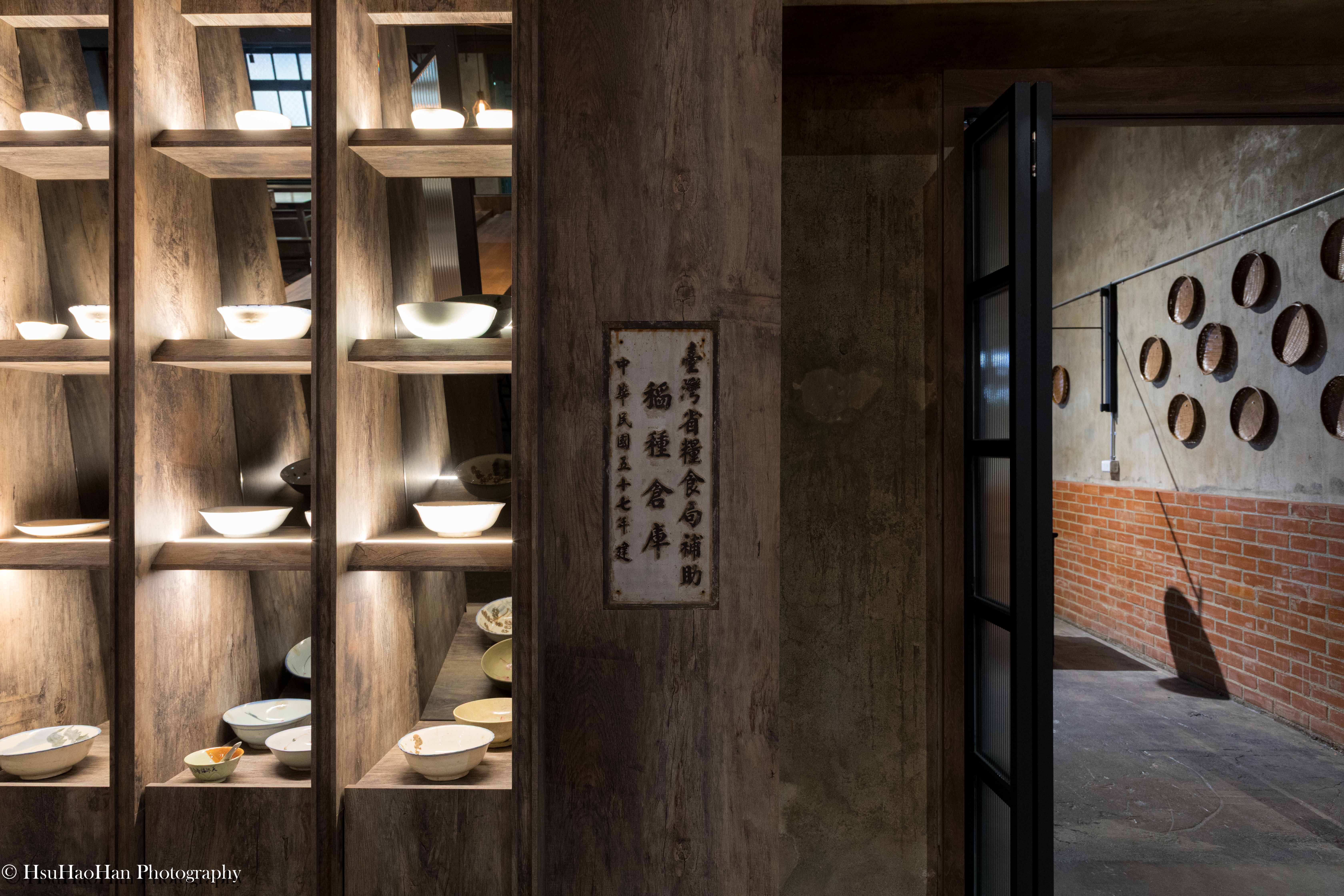 Historic signage of "Taiwan Provincial Food Bureau" preserved on wooden shelves in the renovated barn - 國姓鄉農會農民食堂保留「台灣省糧食局補助」歷史牌匾與木作層架細節 - Photography by Hsu Hao Han