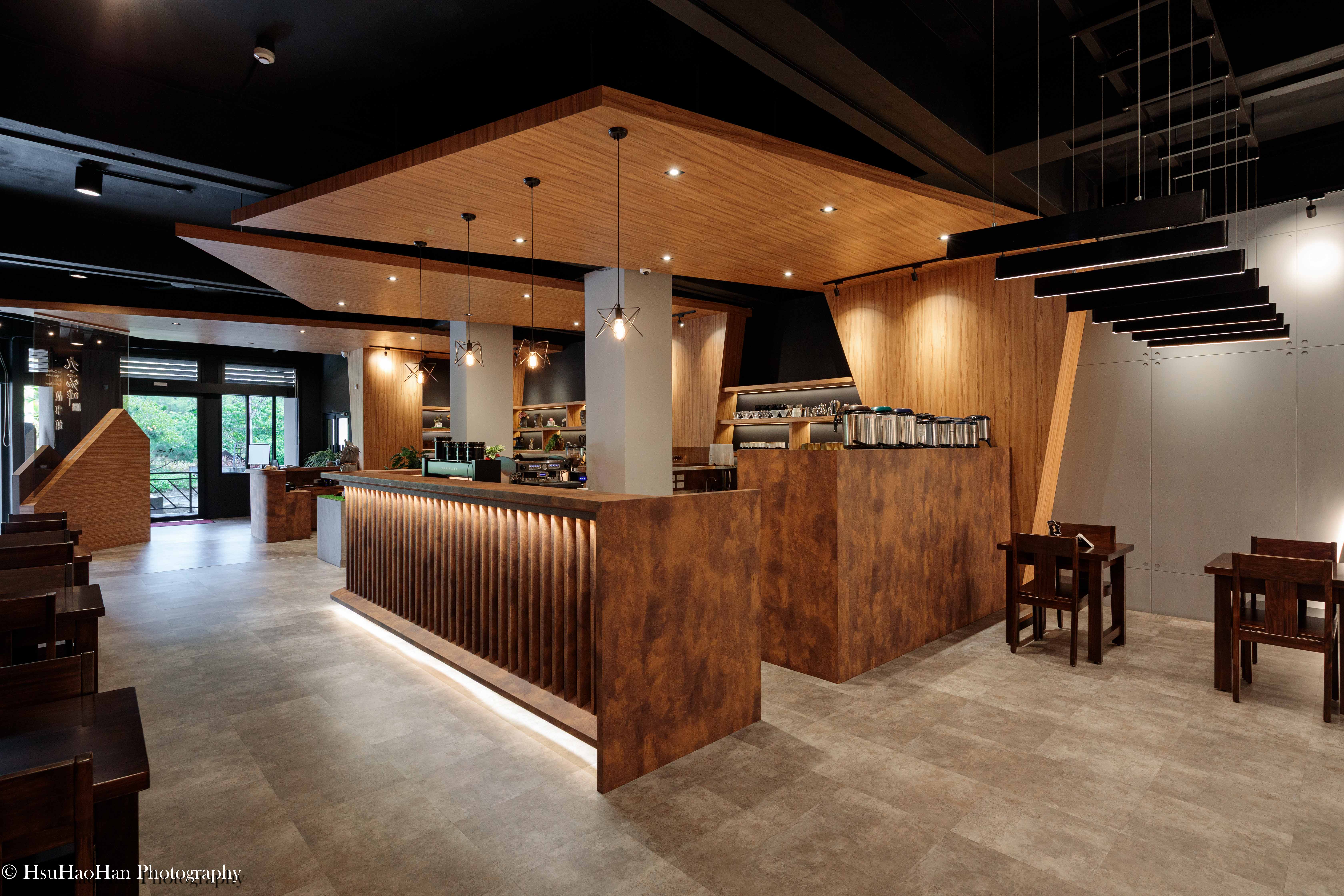 Modern wooden coffee bar counter design with warm lighting and geometric ceiling - 現代風格木造咖啡吧台設計與幾何天花板照明氛圍 - Photography by Hsu Hao Han